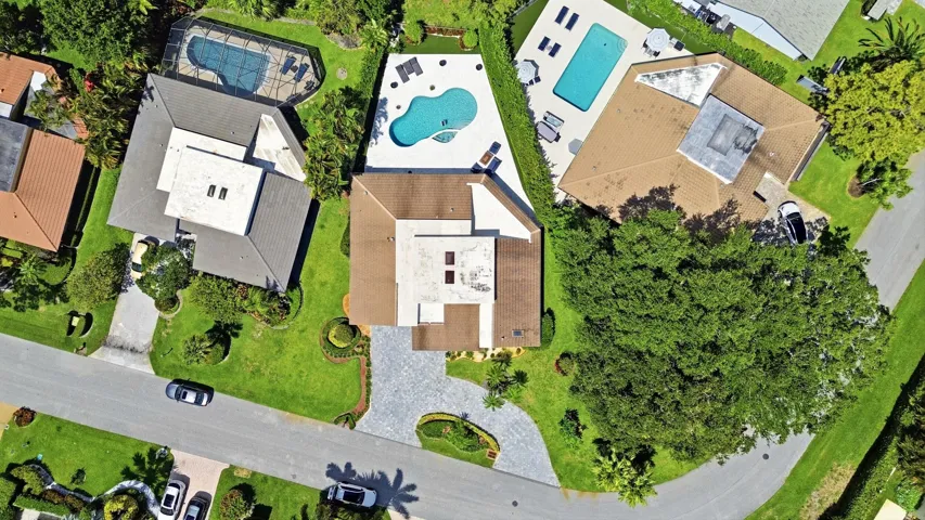 From above, the true rarity of this property comes into focus. Perfectly positioned on an oversized cul de sac lot, the home backs directly to a protected nature preserve, offering an exceptional level of privacy and lush natural surroundings that are seldom found in South Florida. Nestled within the prestigious Seagate Country Club, the only Five Star private club community located just minutes from Downtown Delray Beach, this exceptional residence offers the perfect balance of peaceful seclusion and everyday convenience. Enjoy effortless access to Atlantic Avenue's renowned boutiques, award winning restaurants, pristine beaches, and vibrant coastal lifestyle, all while returning home to the privacy and tranquility of this exclusive setting.