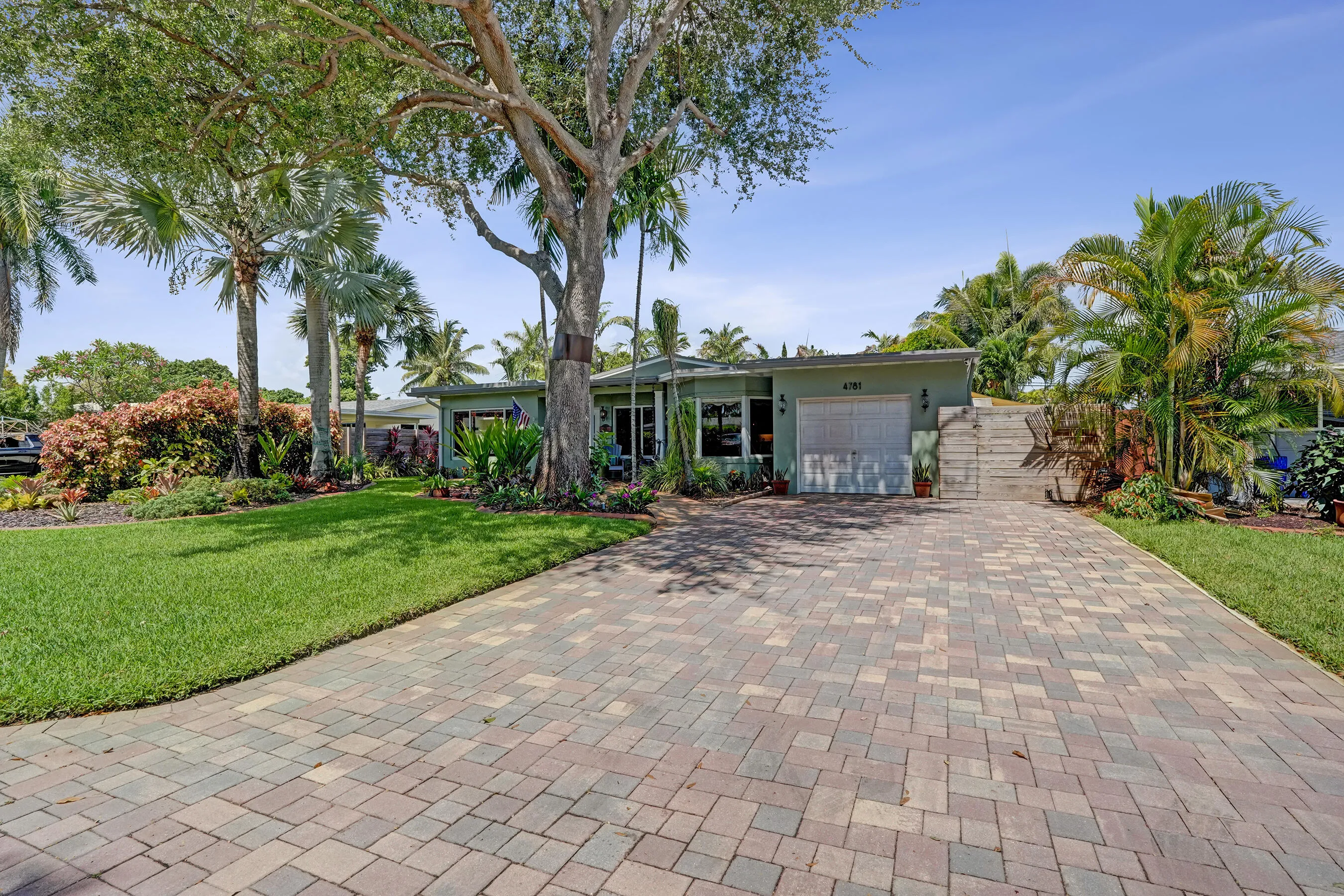 Attached one-car garage with convenient access to the kitchen, laundry room, and mudroom.