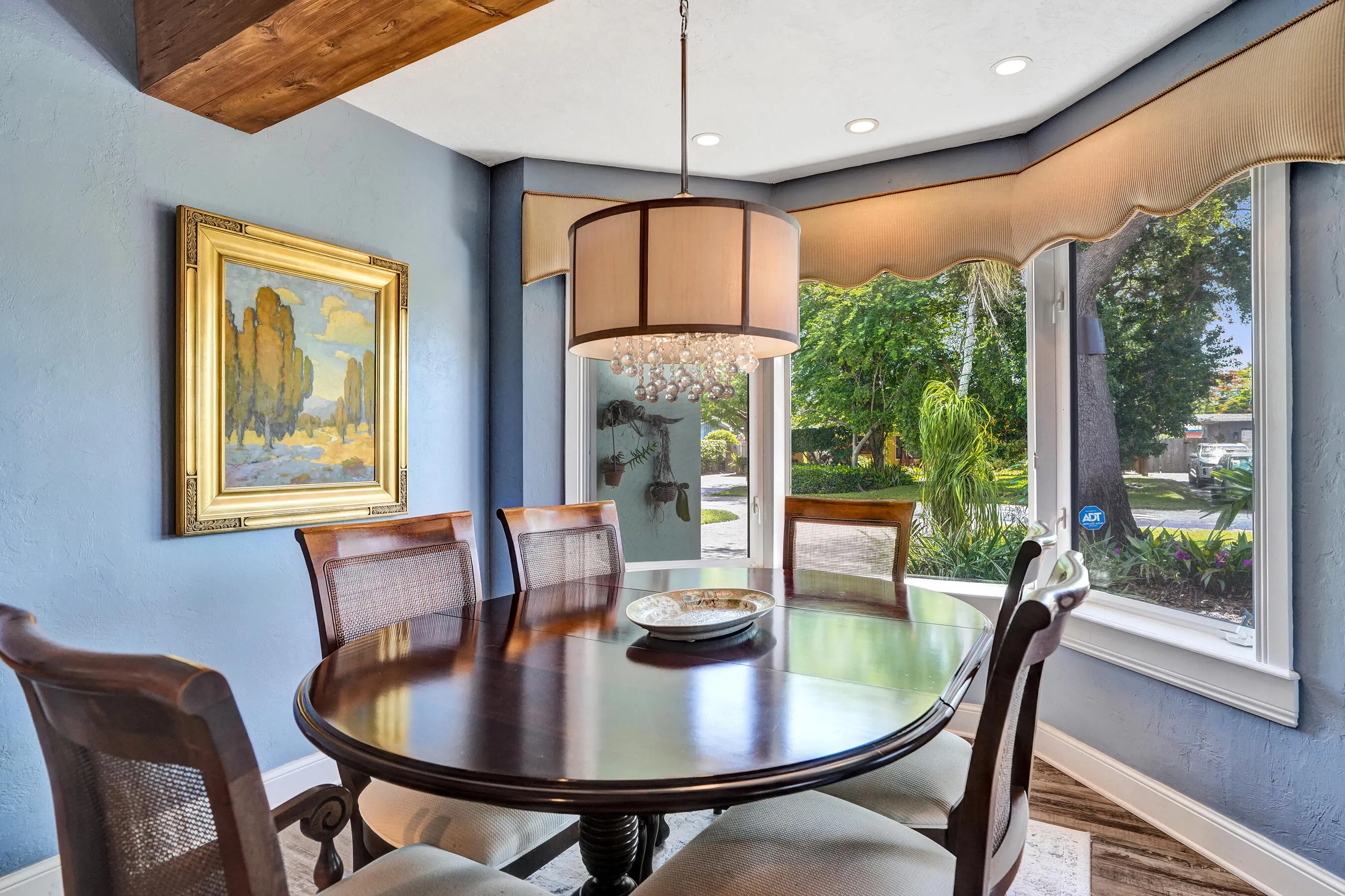 Open dining area adjacent to the chef's kitchen with bay window seating, ideal for everyday living and entertaining.