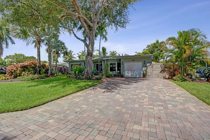 Attached one-car garage with convenient access to the kitchen, laundry room, and mudroom.