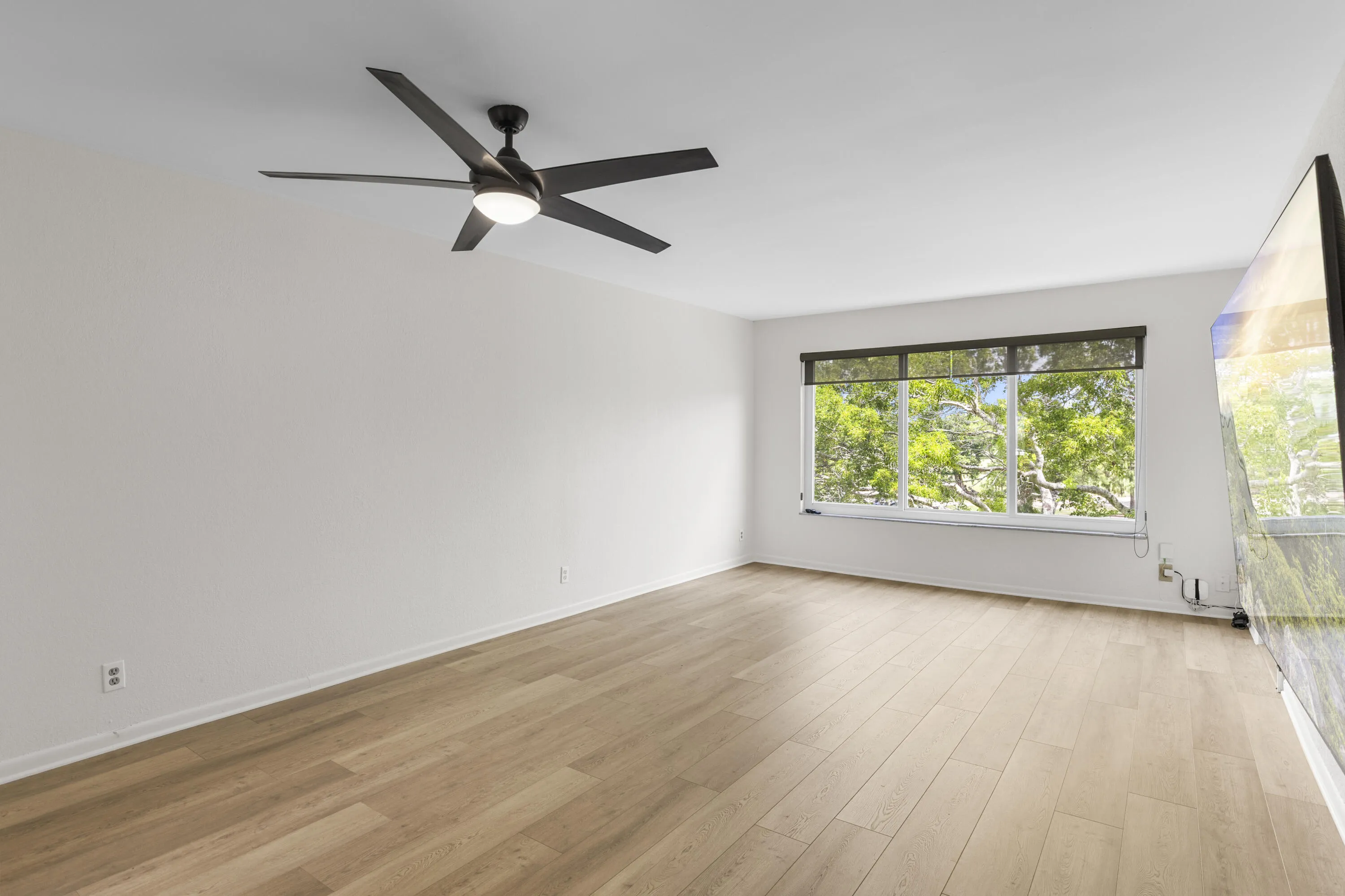 Brand new flooring the living area and Impact window with high-end shades