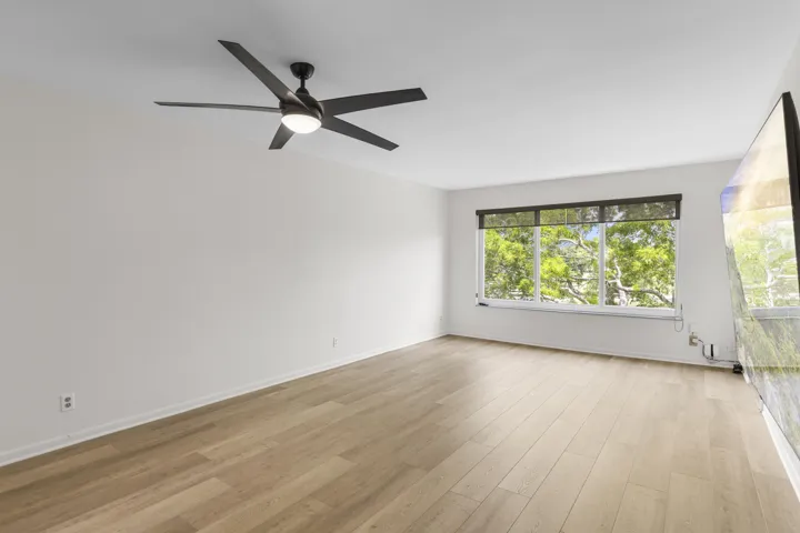 Brand new flooring the living area and Impact window with high-end shades