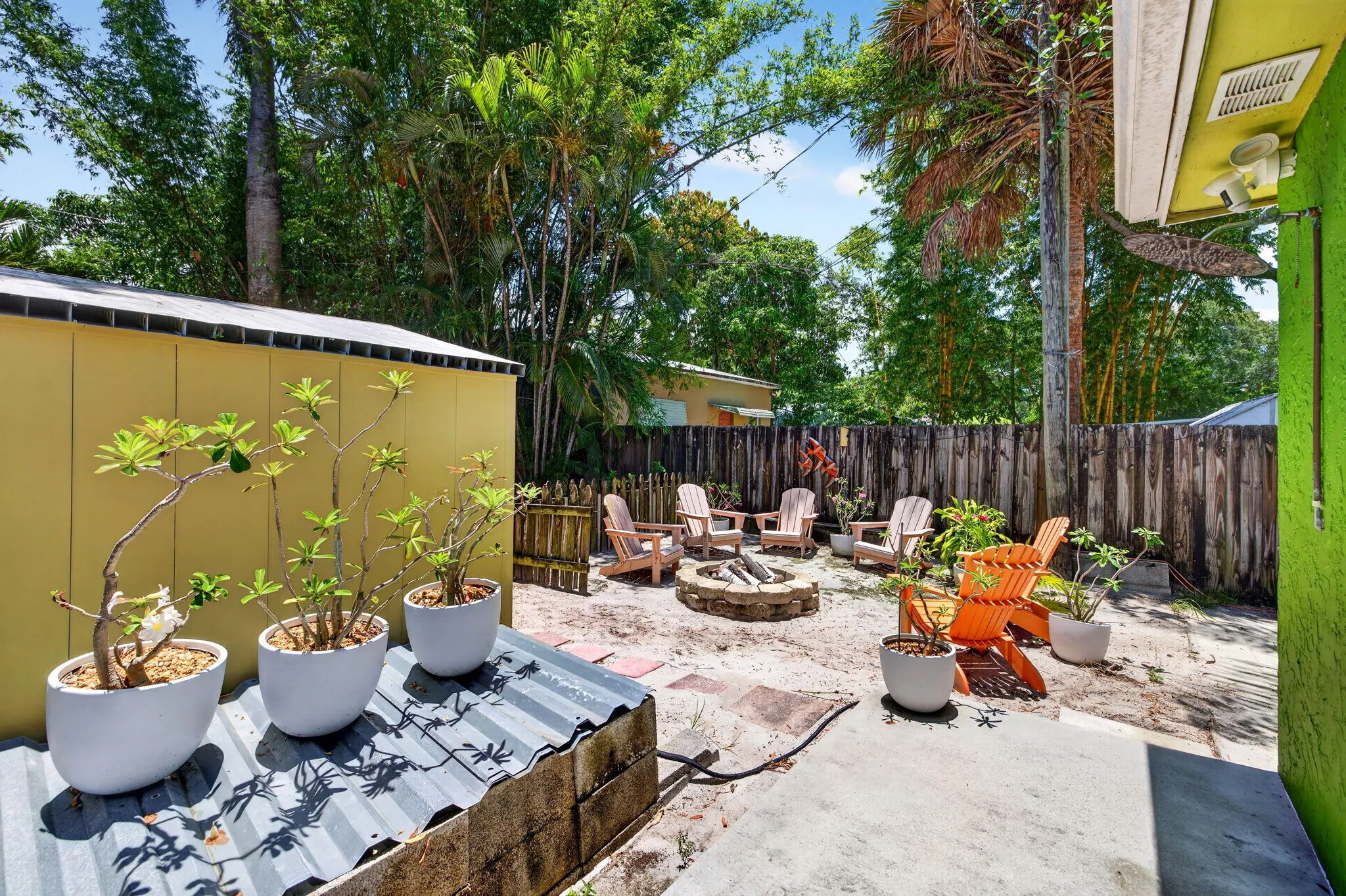 Lovely sitting areas and outside shower right outside the backdoor