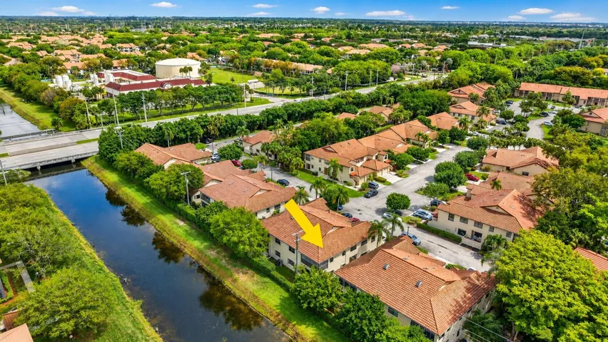 Highlighted coach home with privacy & beautiful community surroundings.