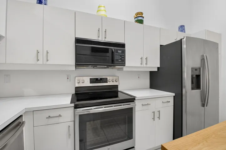 Modern appliances with abundant cabinetry & generous storage.