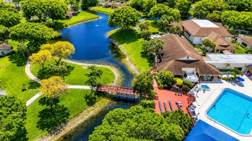 Resort-style pool overlooking scenic lakes & tropical landscaping.