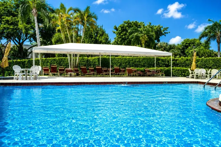 Enjoy sunny days by the beautifully maintained community pool.