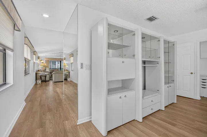 Abundant cabinetry provides stylish storage & display space.