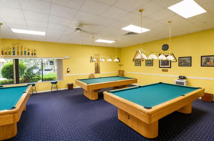 Challenge friends to a game in the community billiards room.