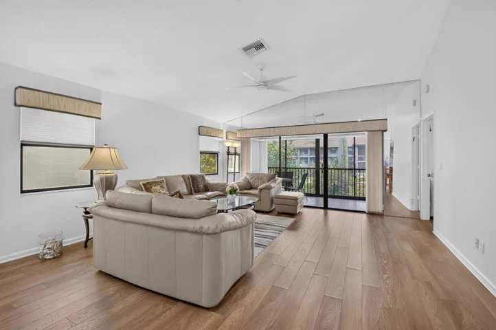 Vaulted ceilings and balcony access create bright, open living.
