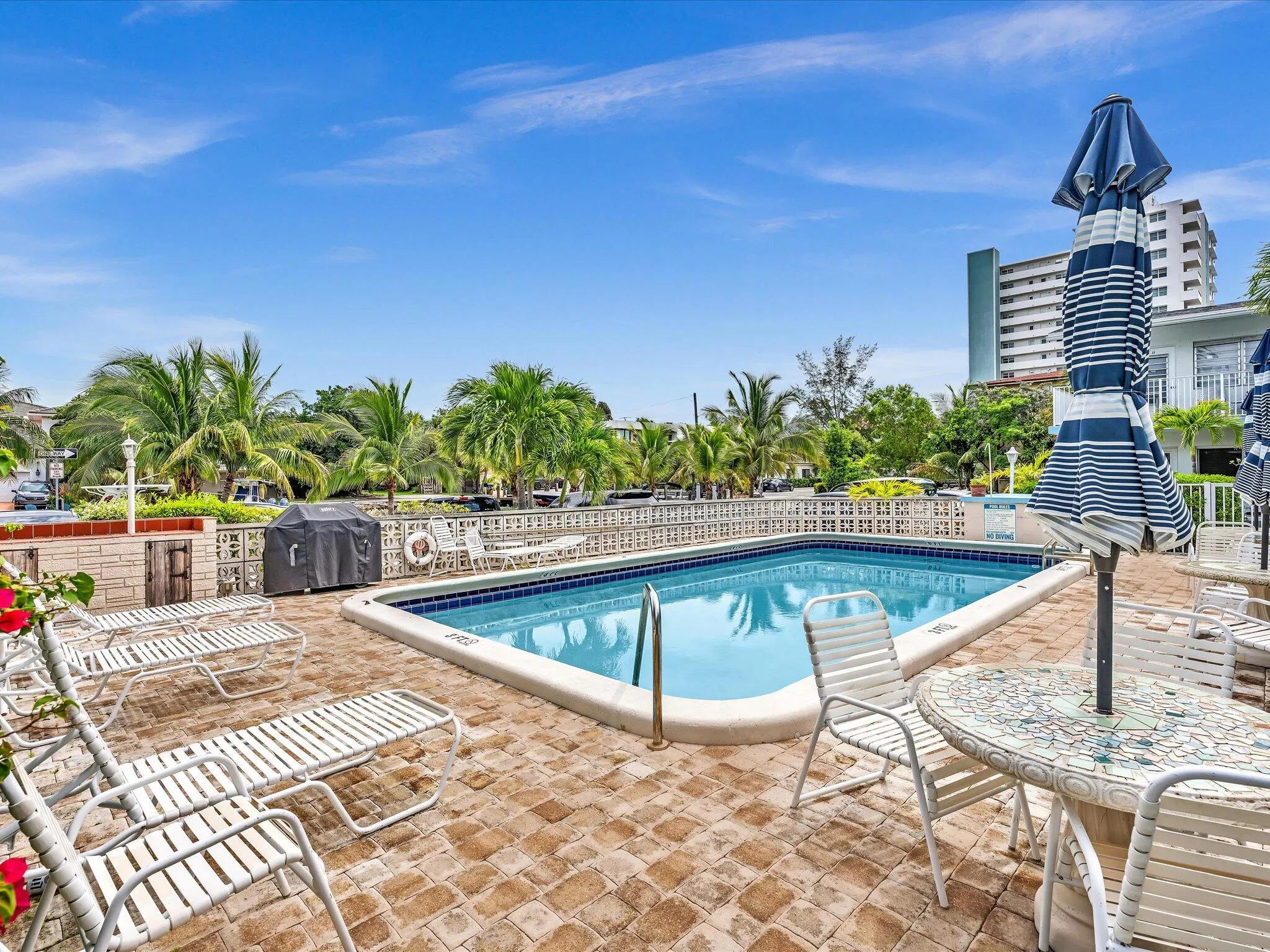 heated pool with BBQ area