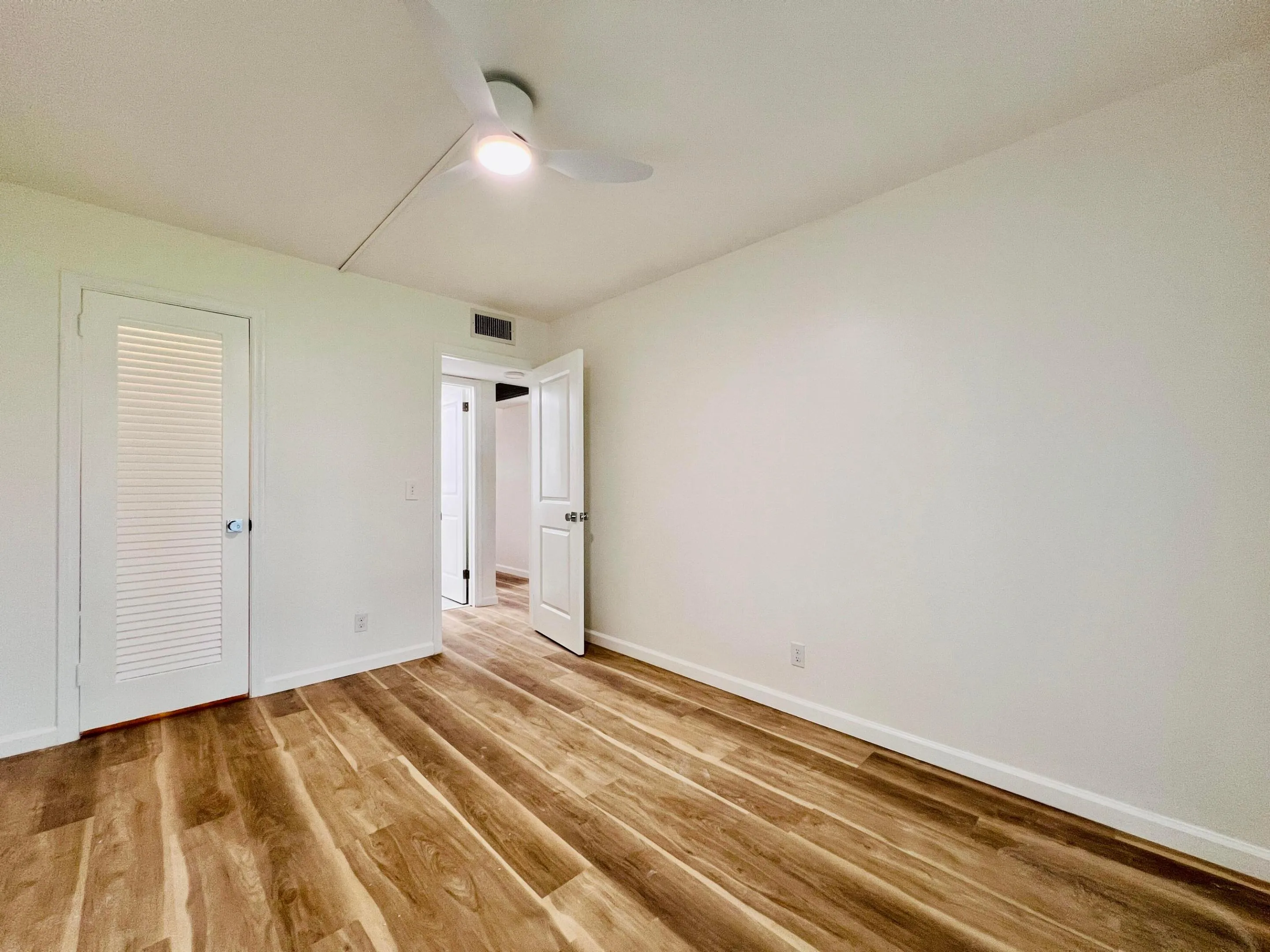 Bedroom Two Features Access to the Lanai and Large Walk-in Closet With Washer/Dryer Hook Up