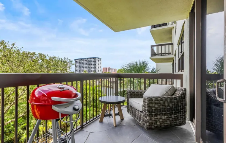 Open balcony with garden and water views