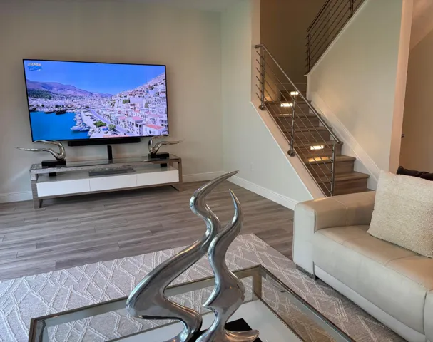 85 inch TV looks small in this very large Living Room