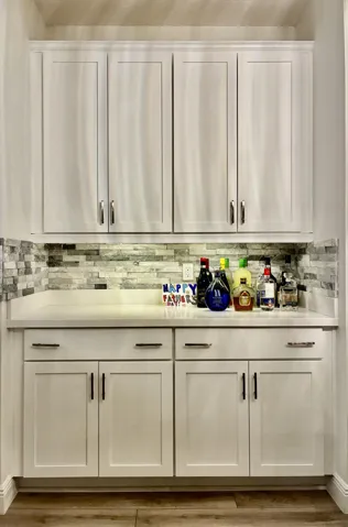 Bar located perfectly for entertaining with ample cabinetry