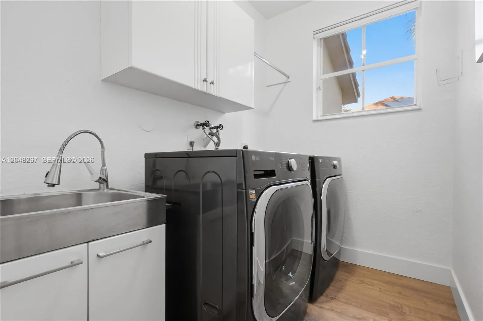 Laundry Room with a laundry tub and faucet.