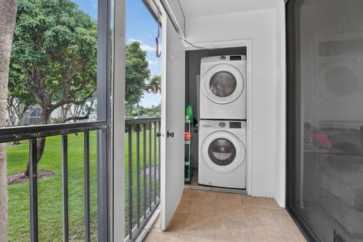 Screened patio with Roll down shutters and Laundry closet