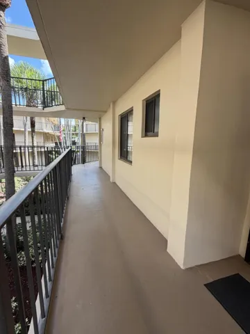 Catwalk to unit with a beautiful center atrium garden