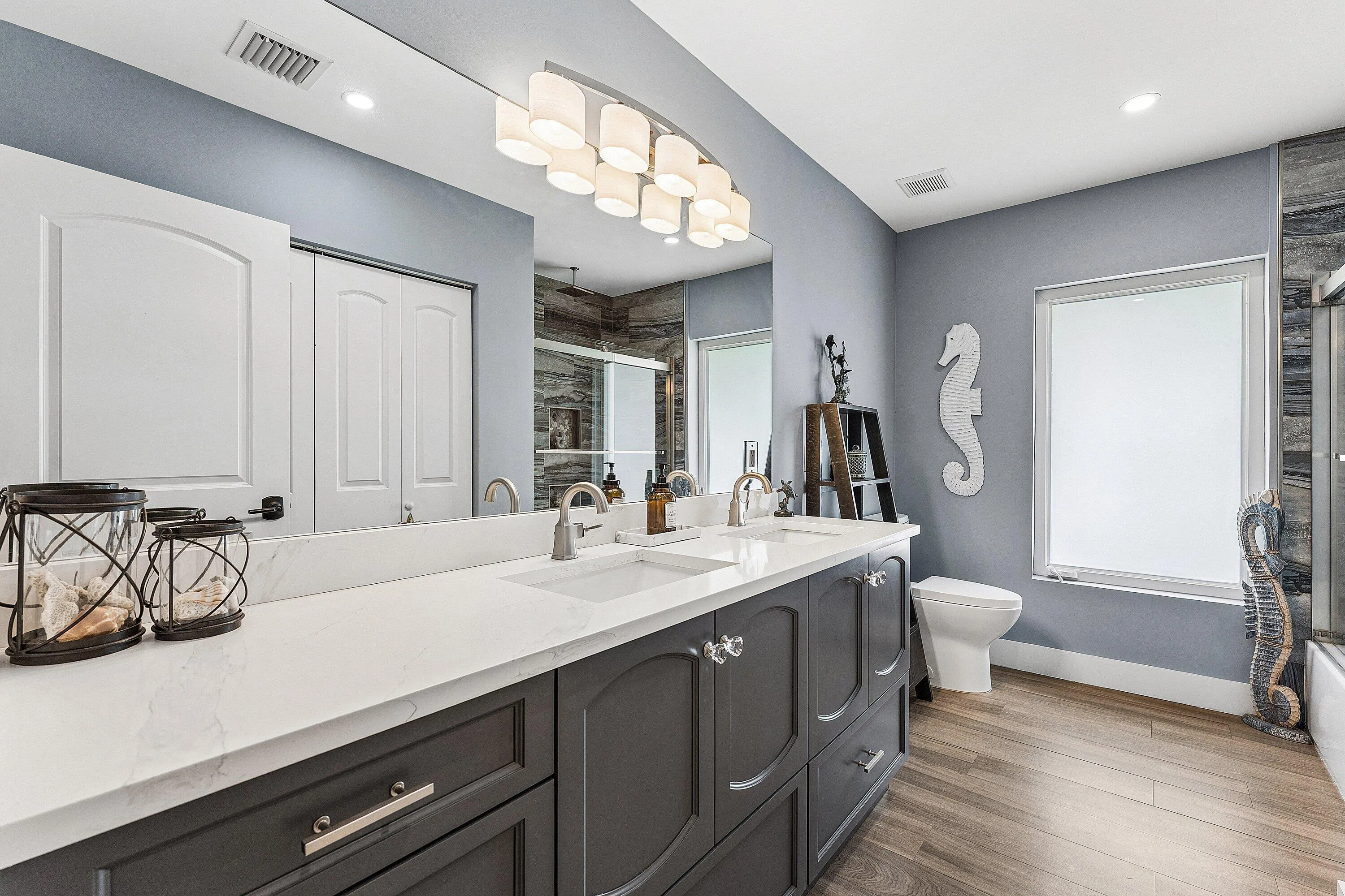 Main Hallway Bathroom with Dual Sinks & Large Linen Closet