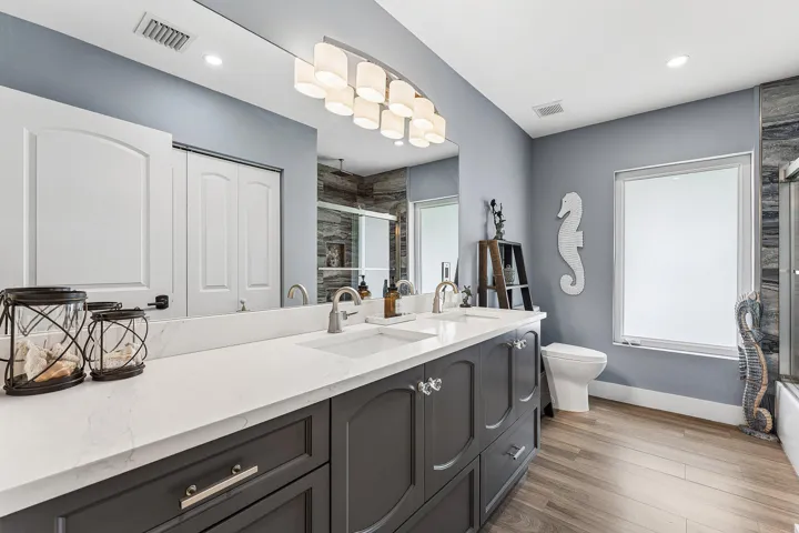 Main Hallway Bathroom with Dual Sinks & Large Linen Closet