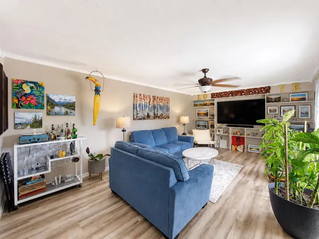 Light and bright living area with built in wall cabinets