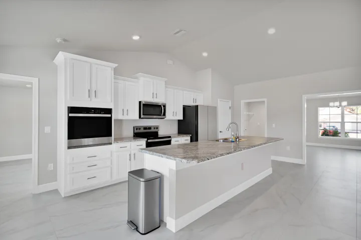 Kitchen opens to living room