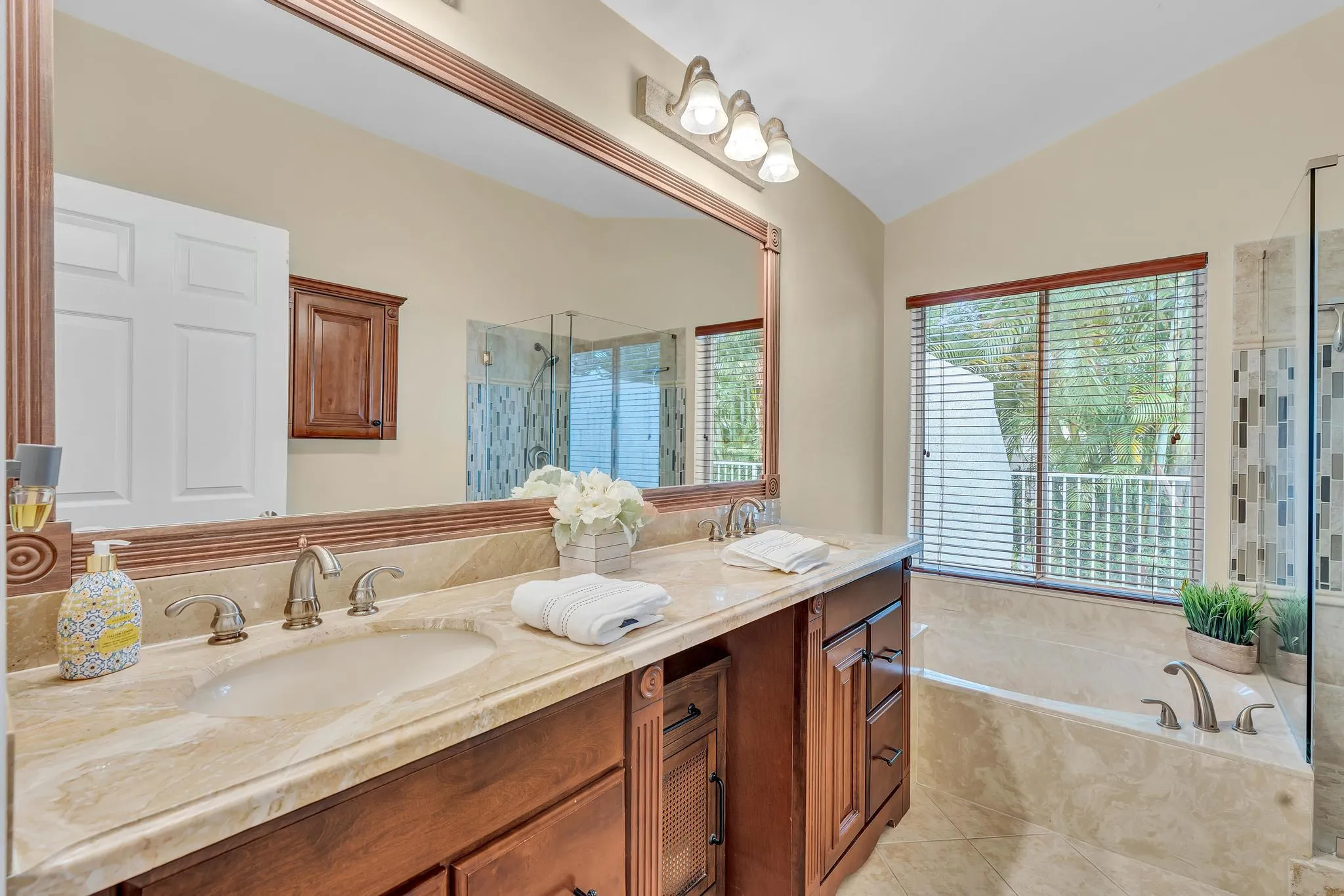 Updated Primary Bathroom with shower and tub double vanity