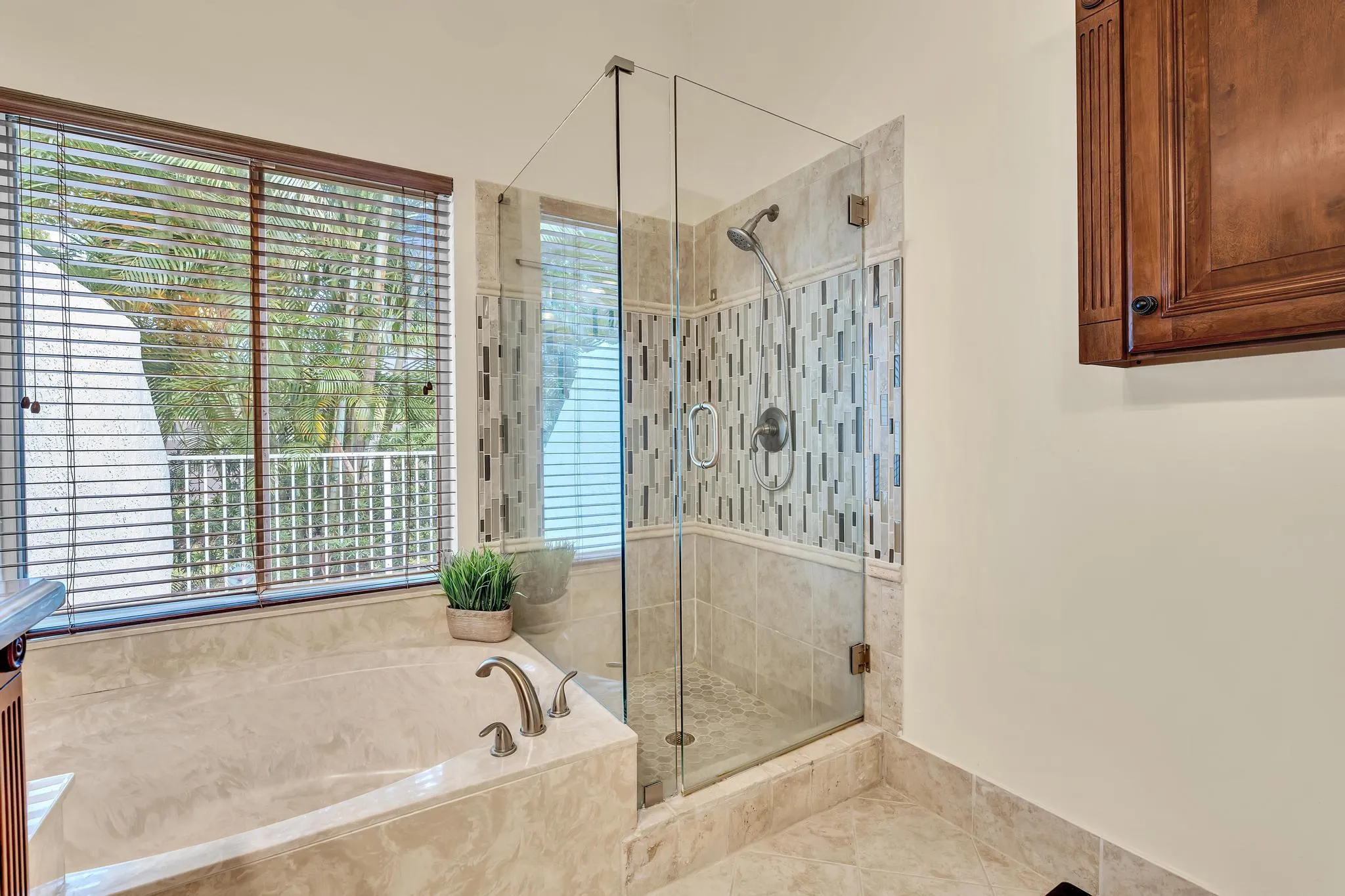 Updated Primary Bathroom with shower and tub double vanity