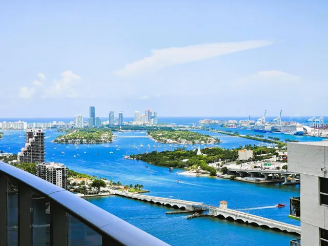 Expansive water scenery featuring multiple islands, distant city skylines, and active waterways