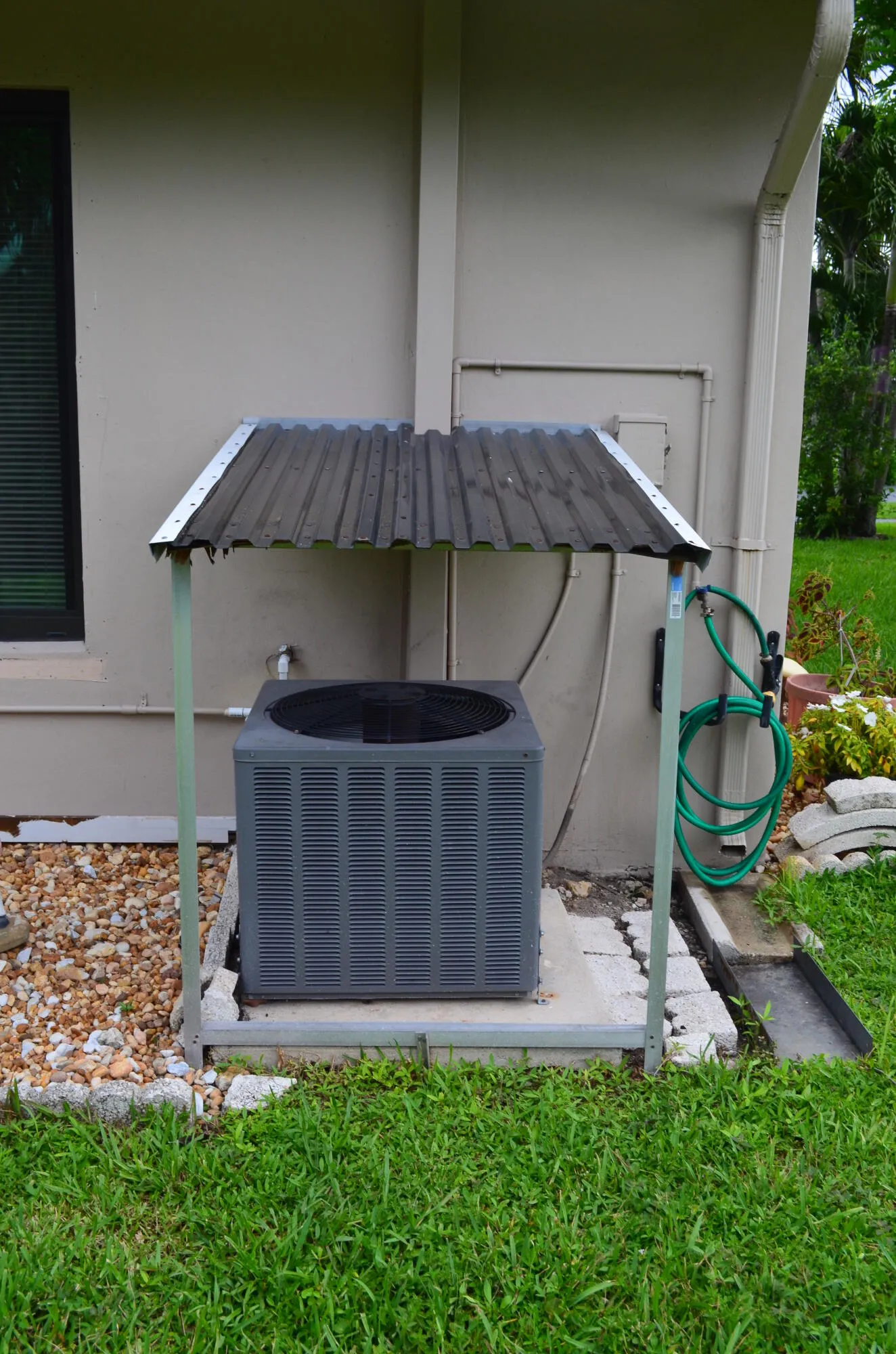 Cover Built Over AC Condenser in Back Yard