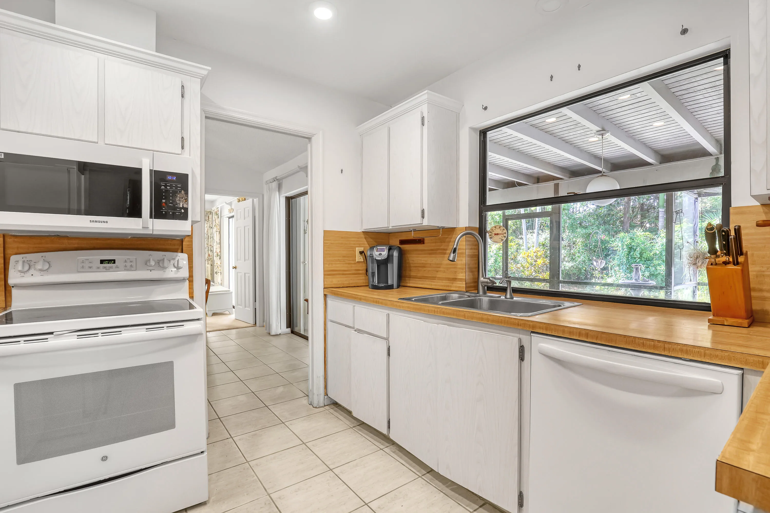 A garden view over the sink turns chores into a moment.