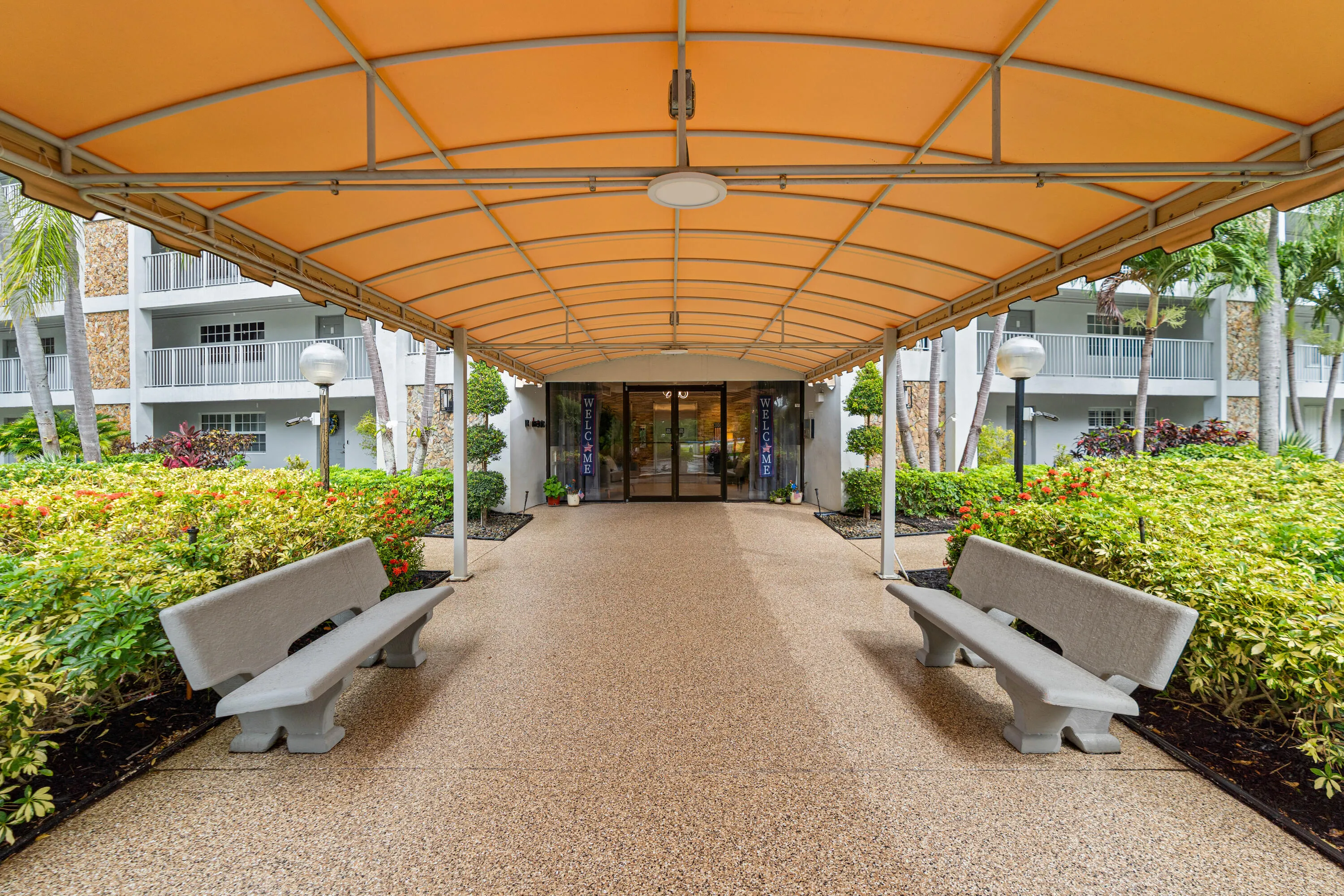 Covered entrance with welcoming porte cochère.