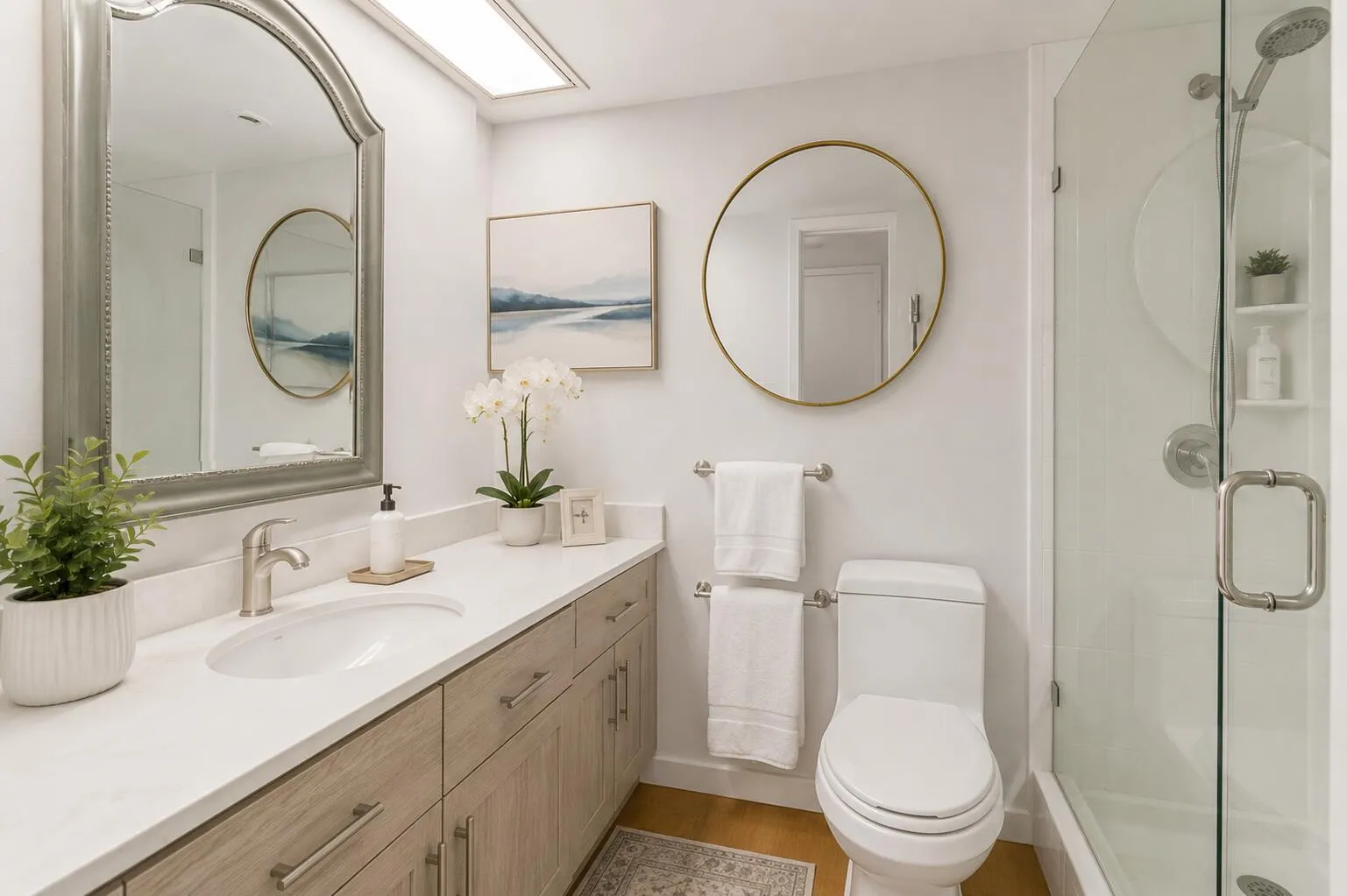 Virtually modified primary bathroom showing the potential with minor tweaking. The bathroom features a renovated shower with a frameless glass door.