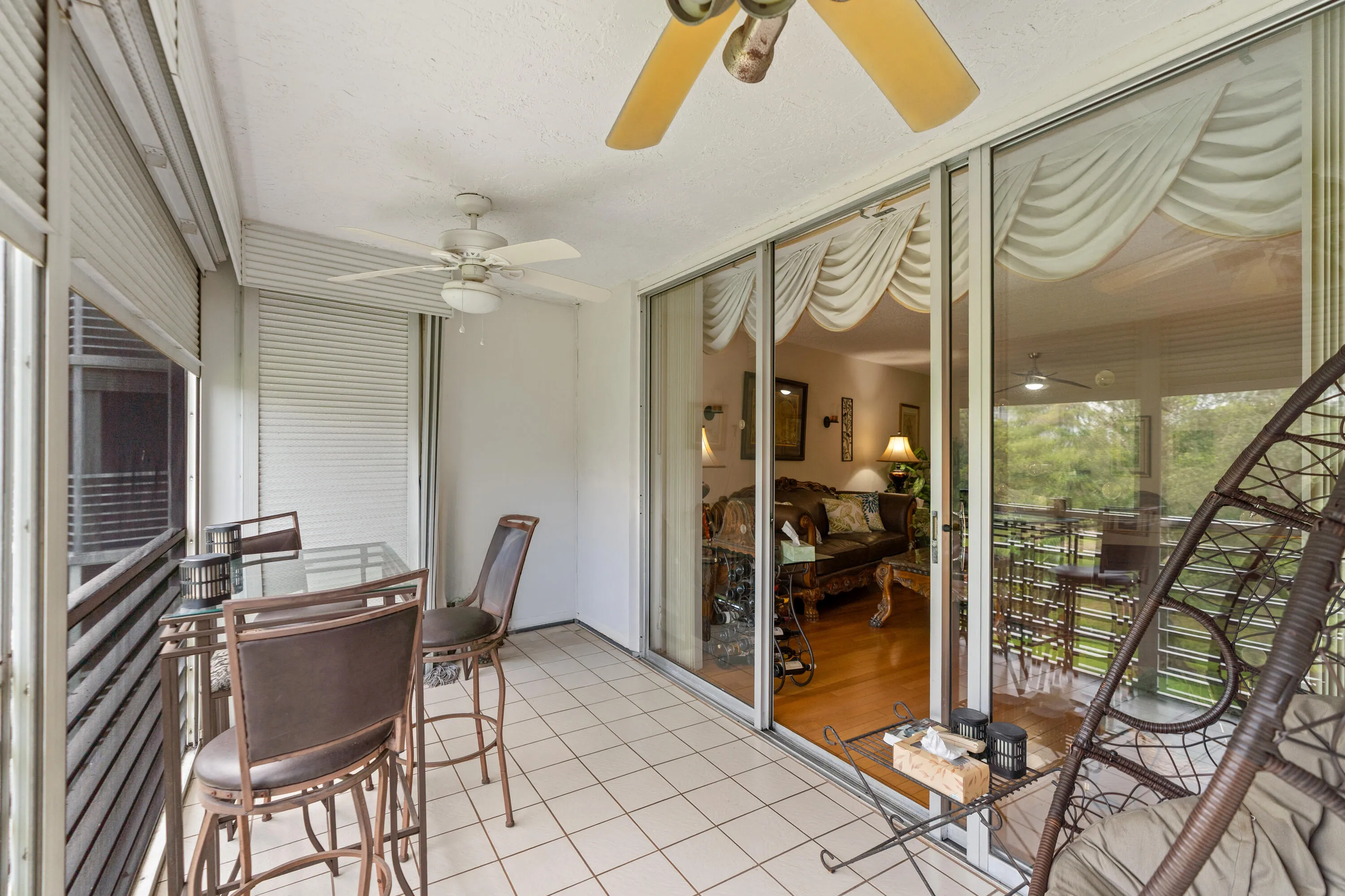Enjoy year-round outdoor living from the spacious screened balcony overlooking the lush golf course and beautifully landscaped grounds.