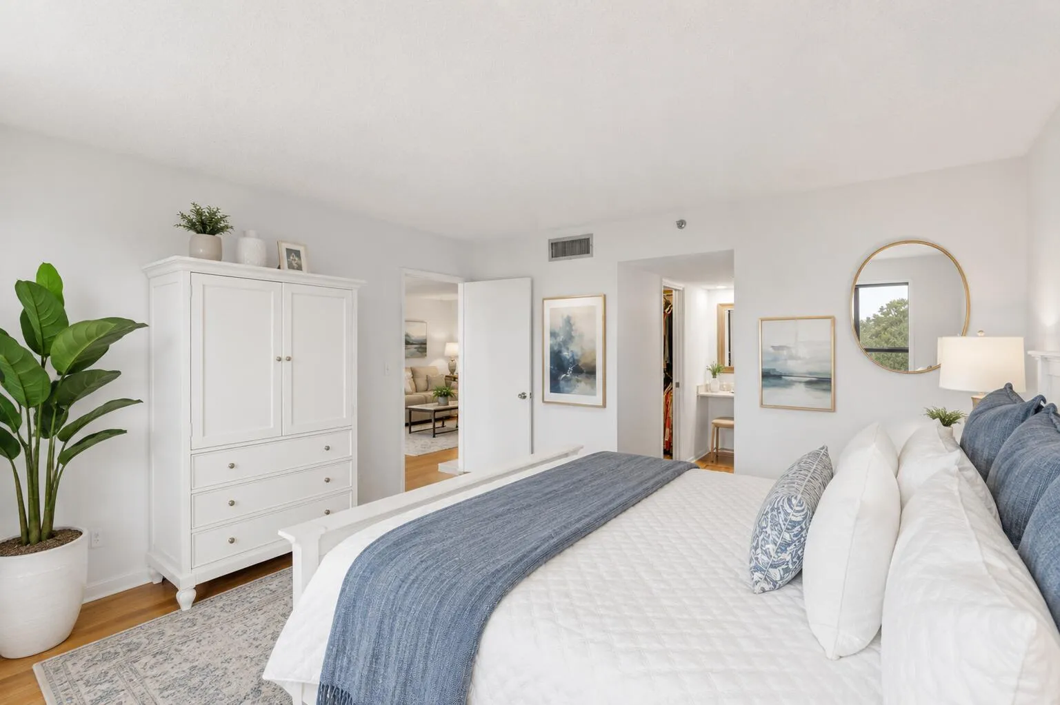 Virtually Staged. Start each day with serene golf course views from this oversized primary suite. The spacious bedroom offers a large walk-in closet, separate dressing vanity, and a renovated ensuite bathroom with a modern frameless glass shower, creating a peaceful retreat you'll look forward to coming home to.