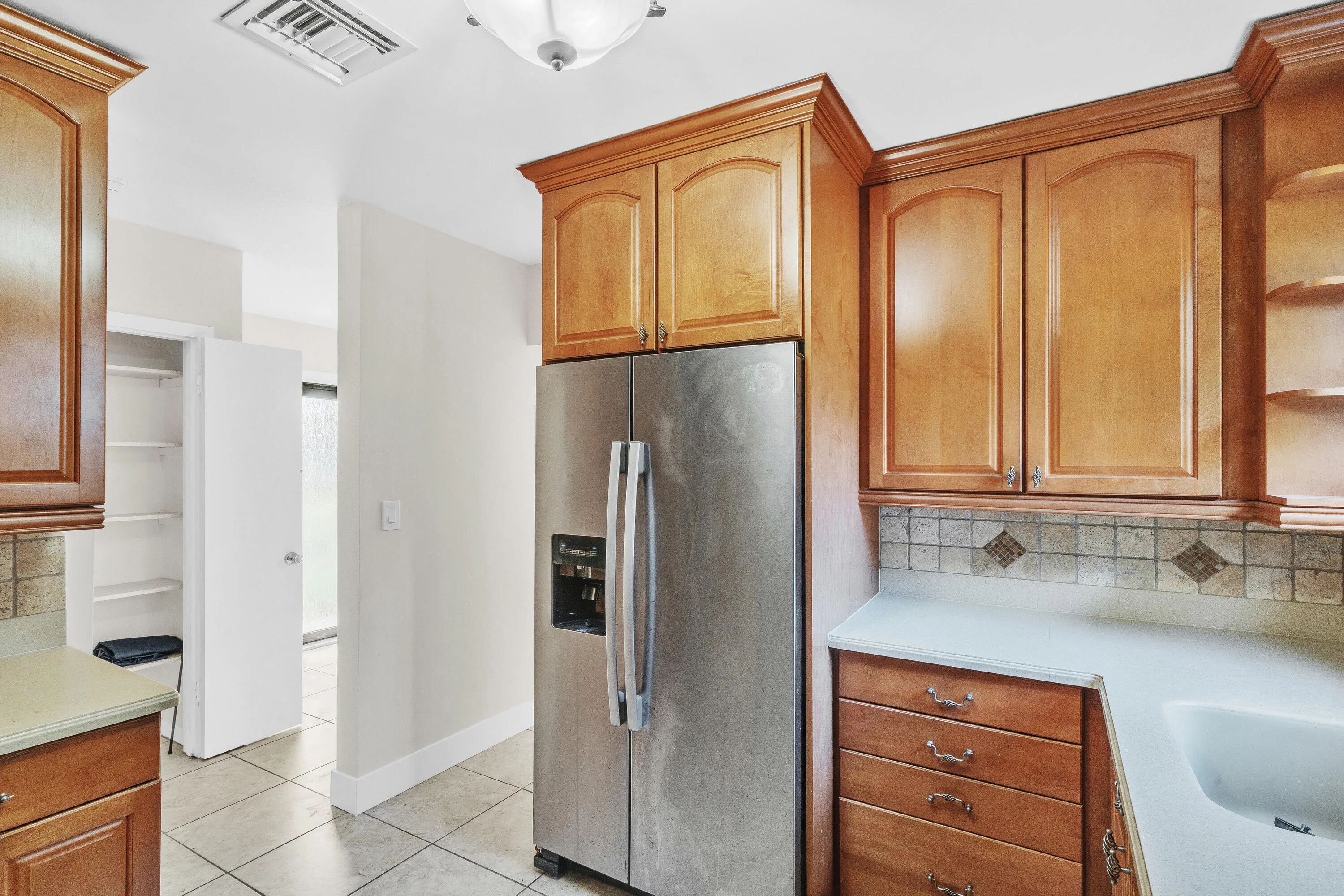 Stainless Steel Appliances & Tiled Back Splash