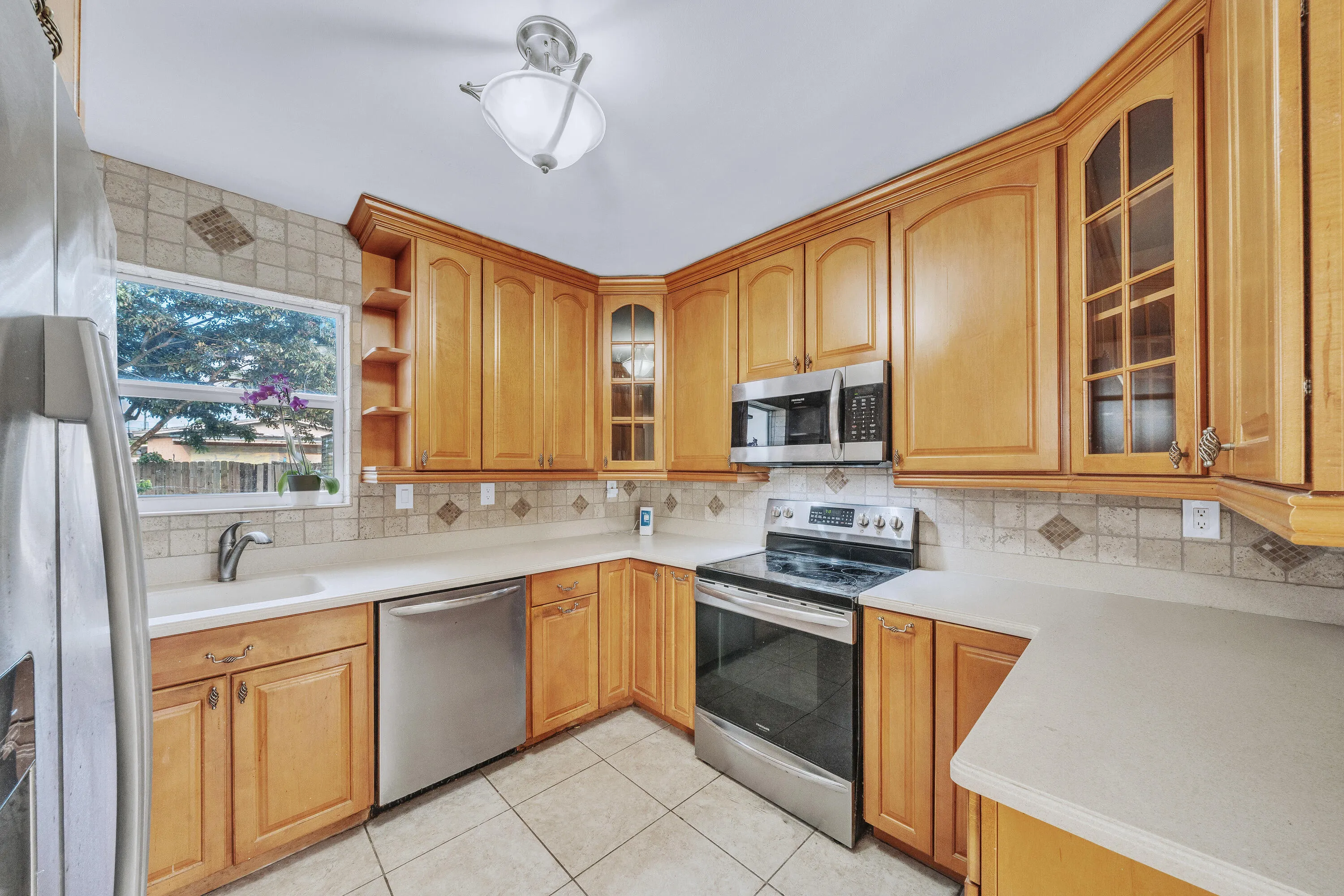 Ceiling-Height Custom Wood Cabinetry in Kitchen