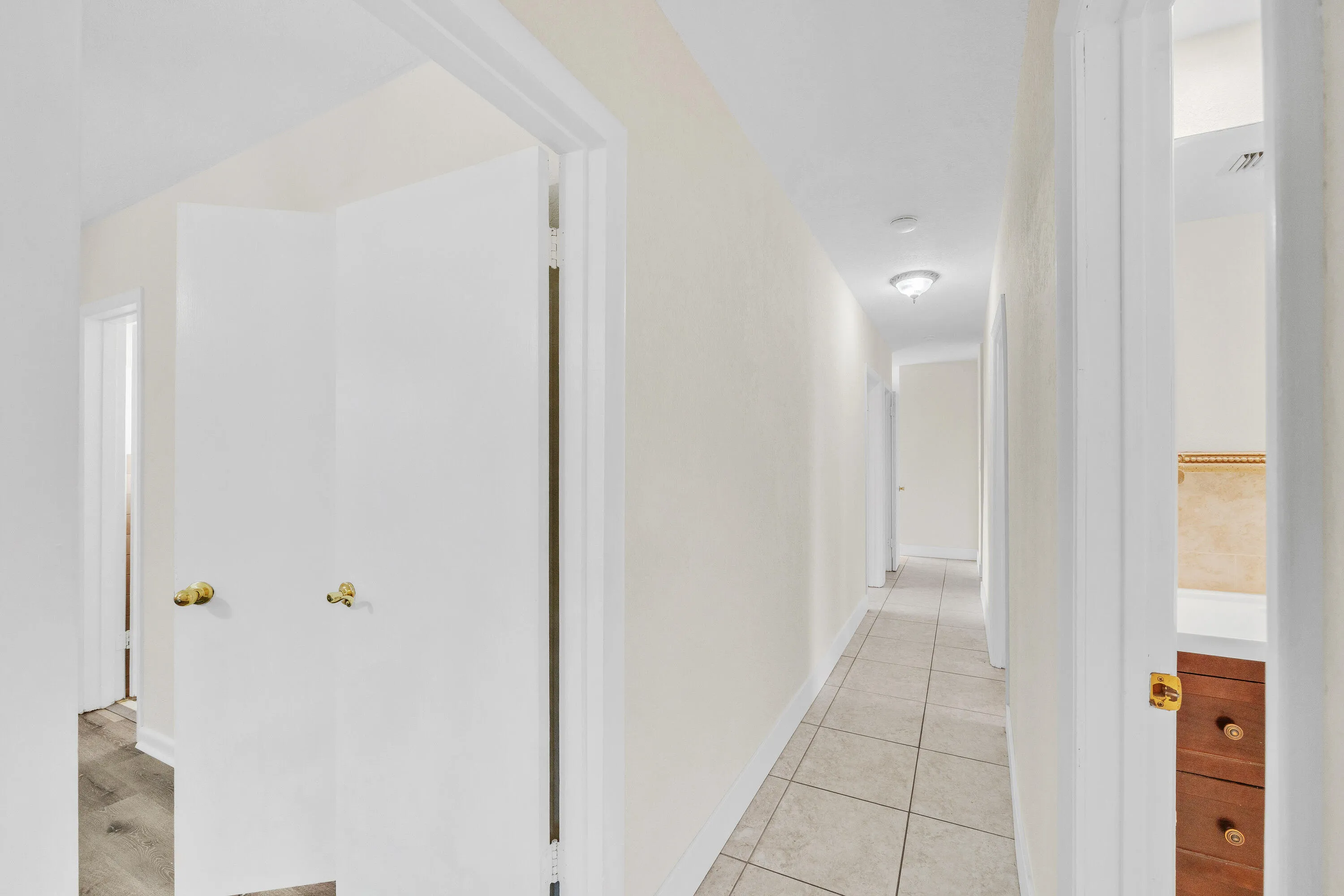 Entry to Primary Bedroom at the End of the Hallway