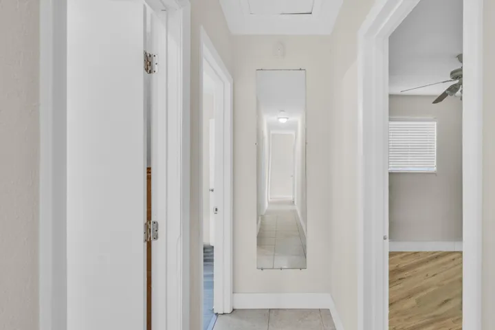 Mirror at End of Hallway and Attic Access Above