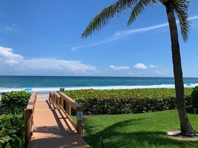 Private boardwalk leading to sandy beach access