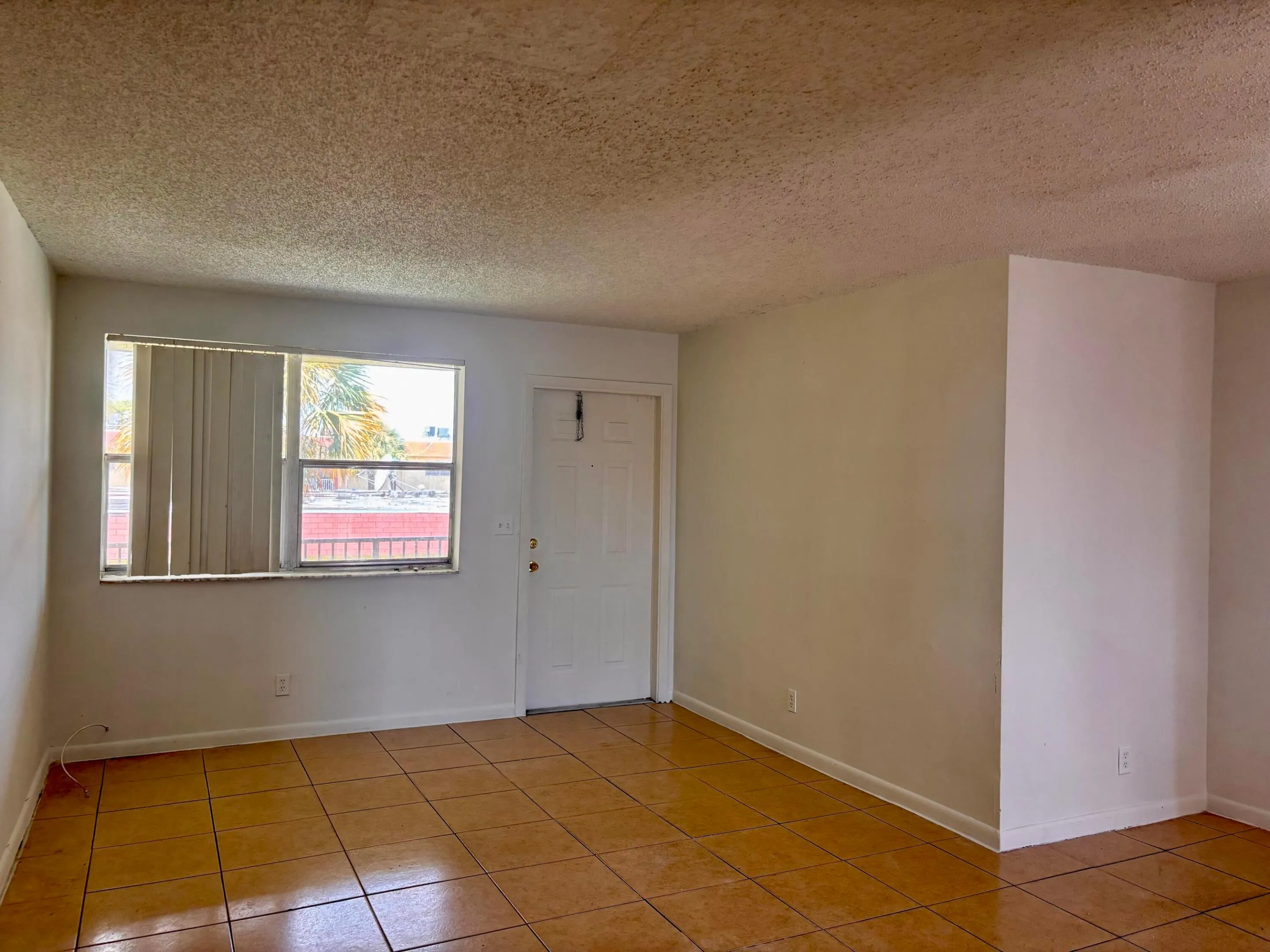 Living room with door to patio