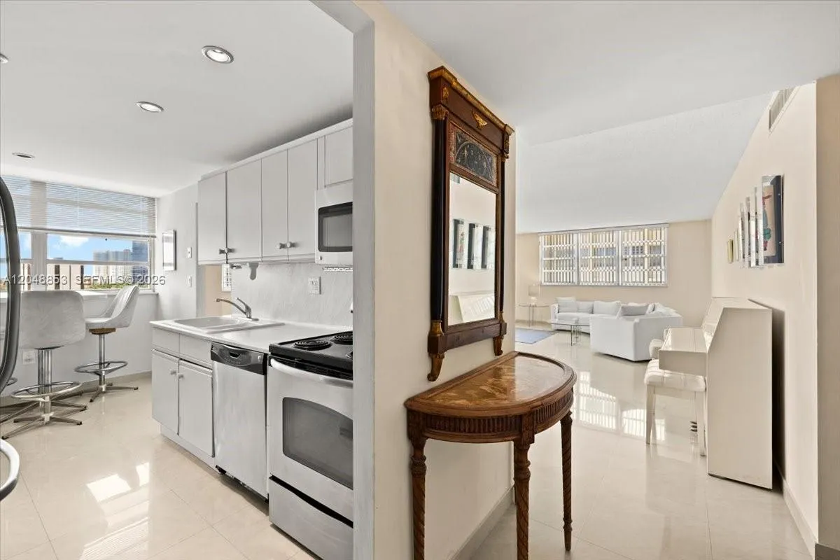 Kitchen and front entry area, nice breakfast table in front of the Intracoastal