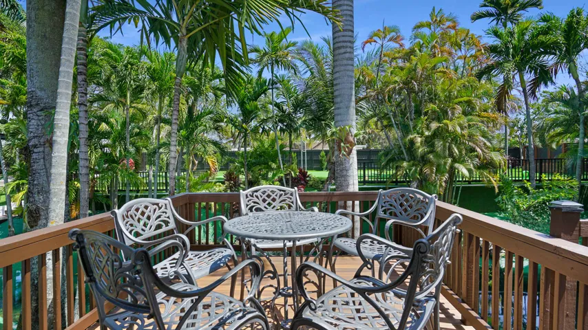 Expansive wood-finish deck with perimeter railings