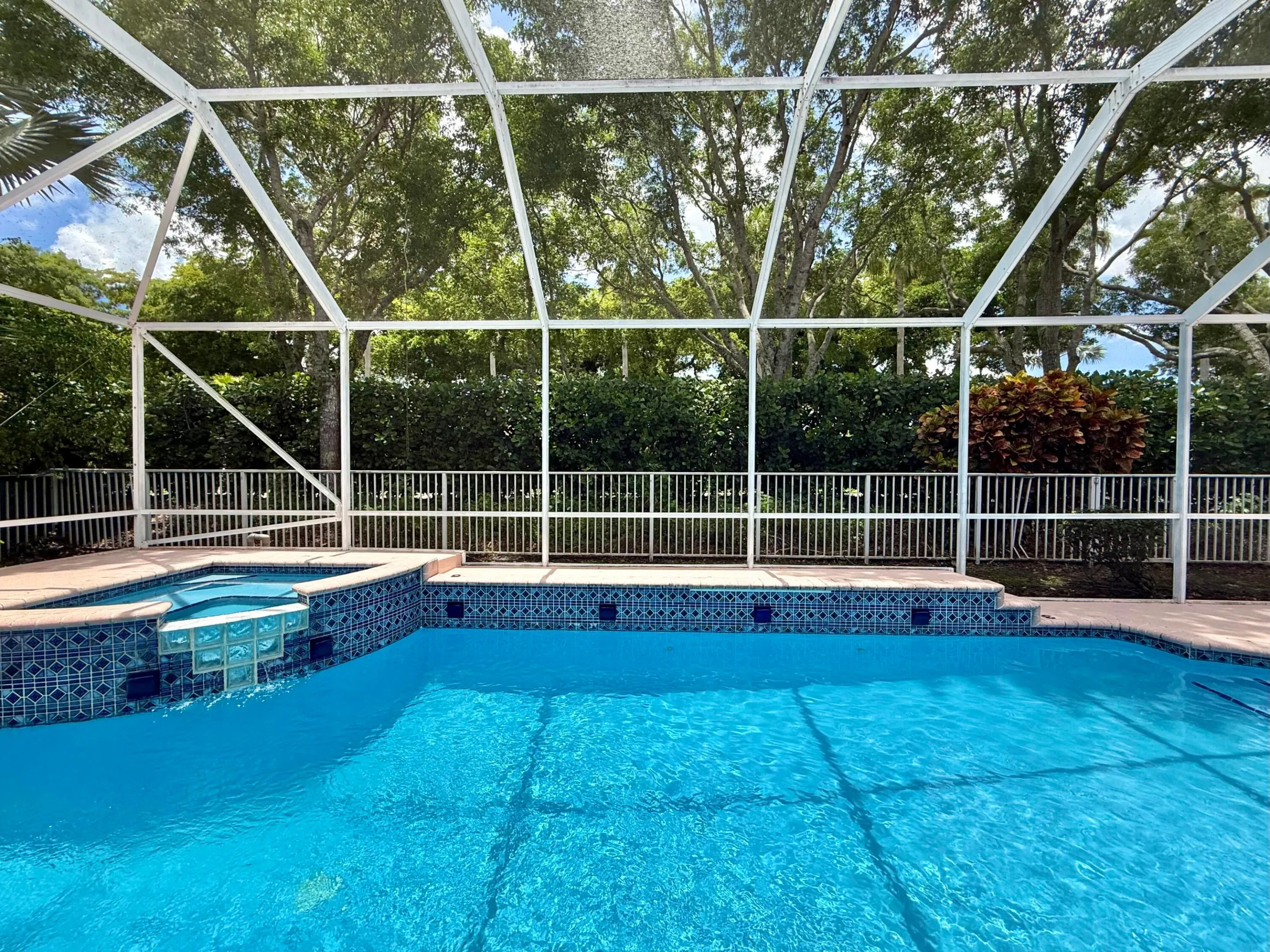 SCREENED IN POOL W/ WATERFALL