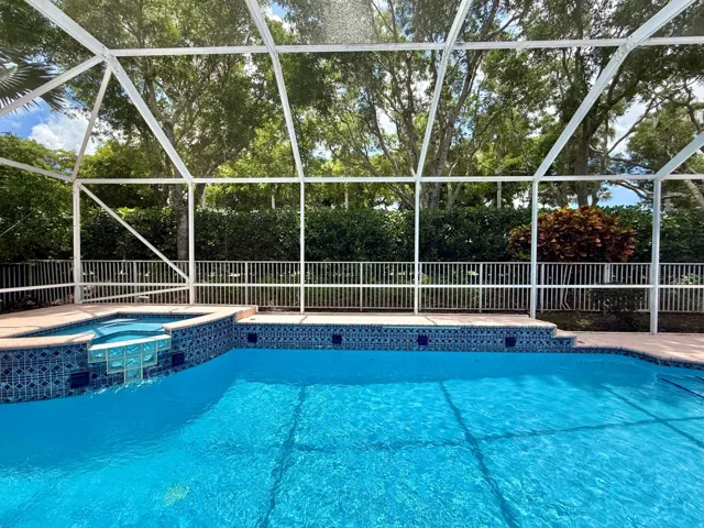 SCREENED IN POOL W/ WATERFALL