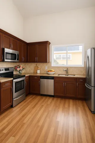 Spacious kitchen featuring wood-finish flooring, dark wood cabinetry, and stainless steel appliances