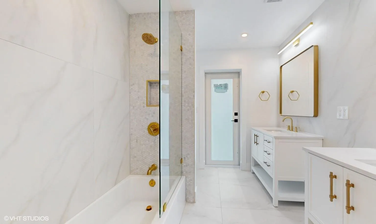 Cabana bath with access door to outside pool and garden area. Cabana bathroom has bathtub and shower combination with a built in bench for comfort while taking a shower and/or bath