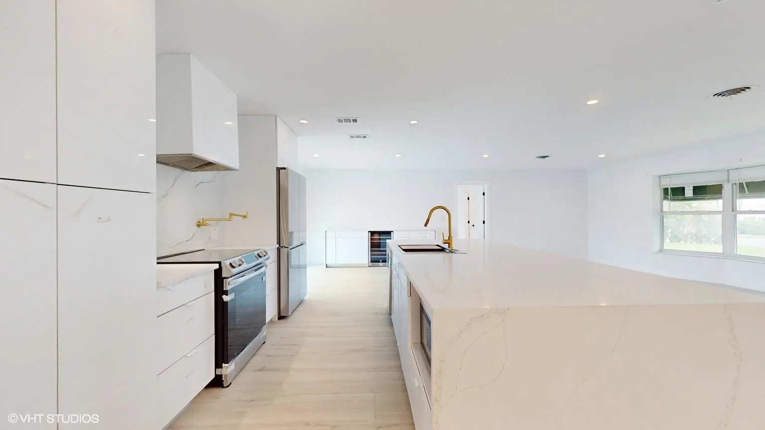 Side view of kitchen with view of dining room in the background