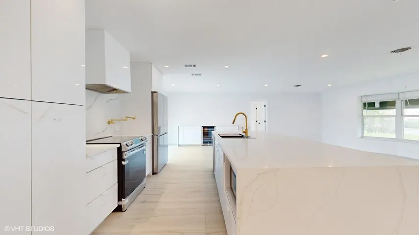 Side view of kitchen with view of dining room in the background