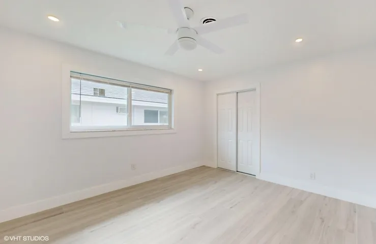 Bedroom with windows facing side of house